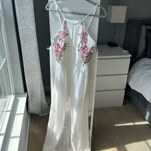 White and floral pink jumpsuit with shorts and a skirt